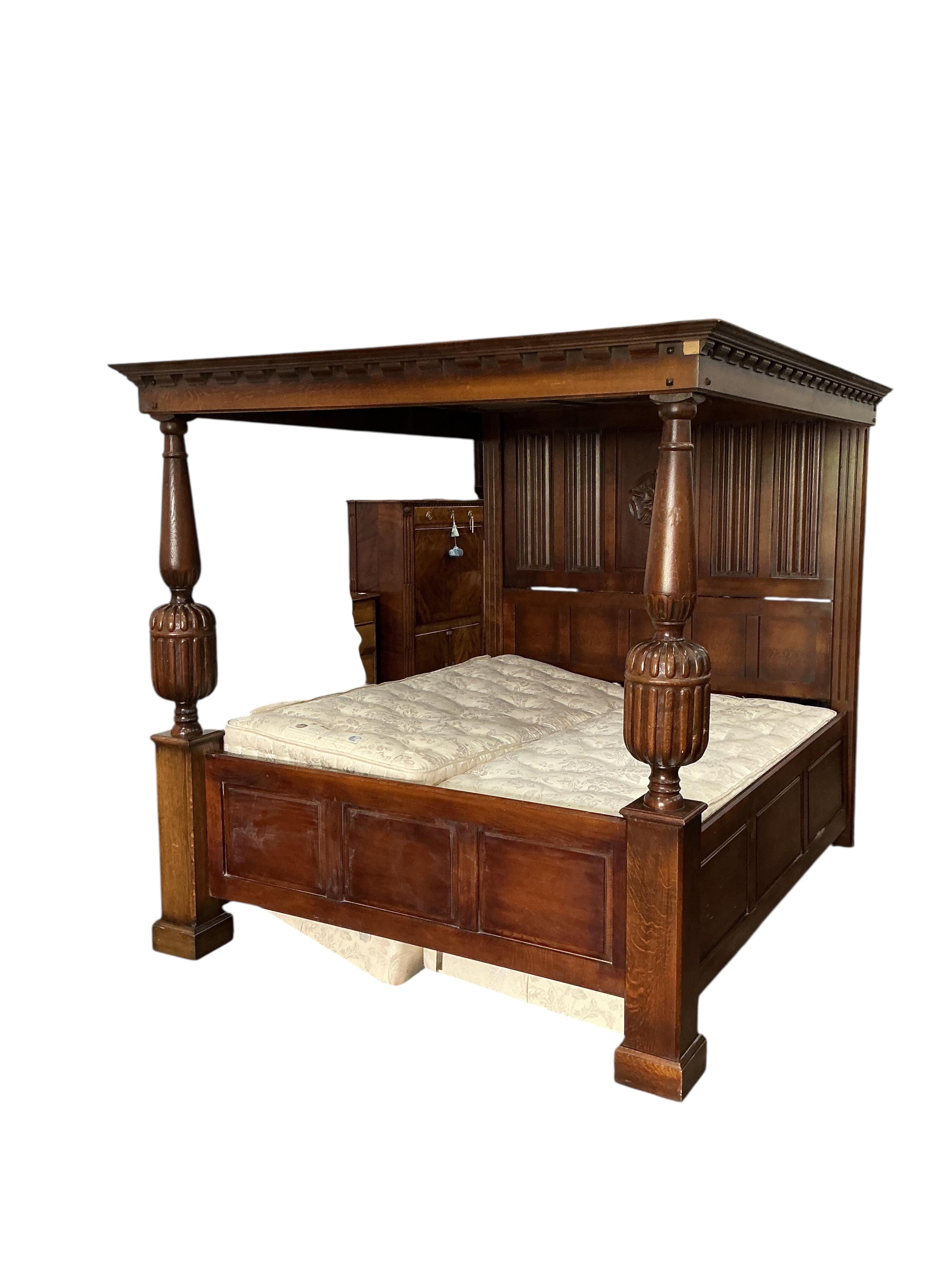 An 18th century style carved oak four poster bed frame, width 190cm, length 230cm, height 198cm with mattress